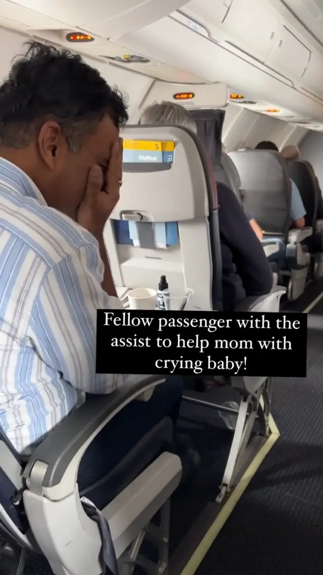 Stranger helps calm baby on flight with peek-a-boo